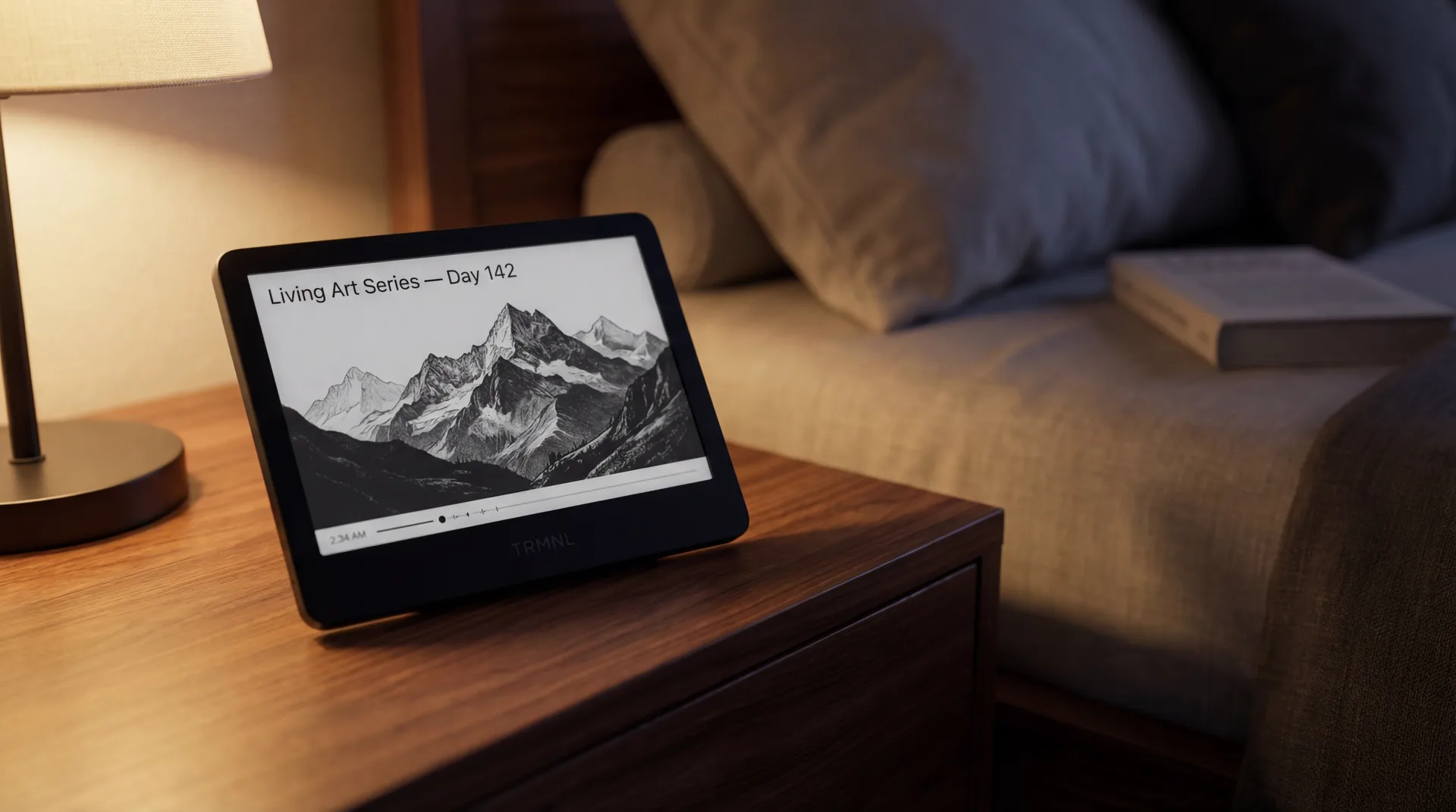 TRMNL on nightstand showing Living Art Series Day 142 mountain landscape