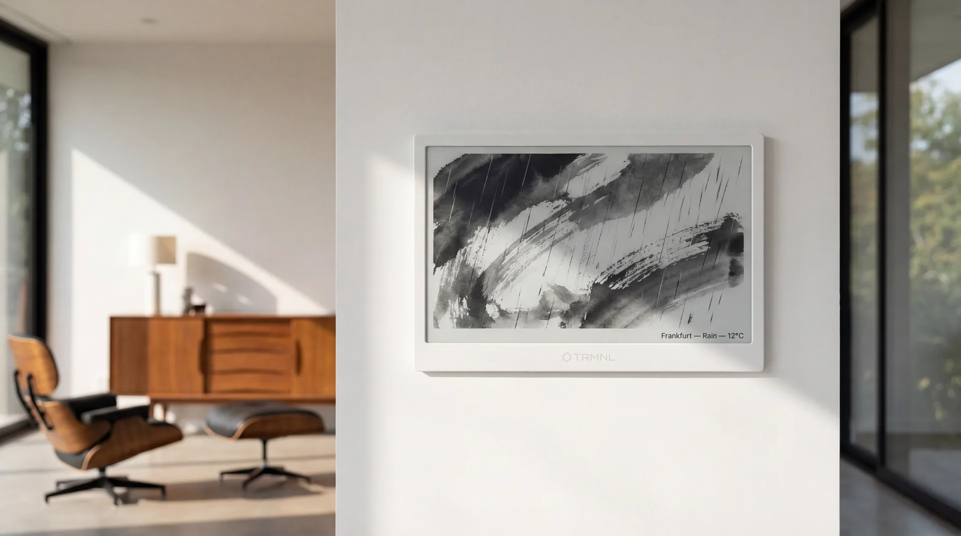 TRMNL display wall-mounted showing weather-responsive ink wash composition